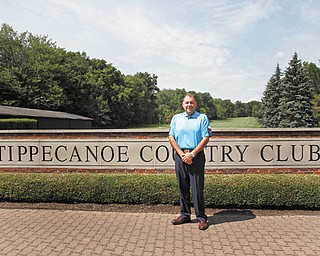 Michael Spiech, golf pro at Tippecanoe Country Club, stands by the sign at the Canfield course, where Round 2 of the 2012 Greatest Golfer of the Valley tournament will take place Saturday.