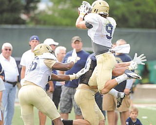 Pittsburgh safety Ray Vinopal leaps to catch a pass during practice. Vinopal, a Cardinal Mooney football standout, and his Panther teammates open their season Sept. 1 at home against the Penguins of Youngstown State University.