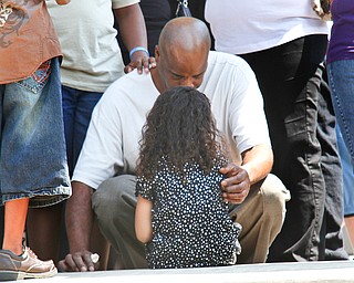 Mourners console each other after the funeral of Bryce Linebaugh, 8, Friday, Aug. 24, 2012.