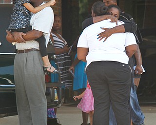 Mourners comfort each other at the funeral of Bryce Linebaugh on Friday, Aug. 24, 2012.