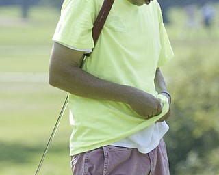 William D Lewis The Vindicator  Greg Cook cleans his golf ball on his shirt Friday at Mill Creek.