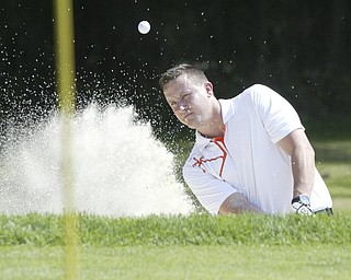 William D Lewis The Vindicator  Steve Davies blasts out of sandtrap Friday at Mill Creek.