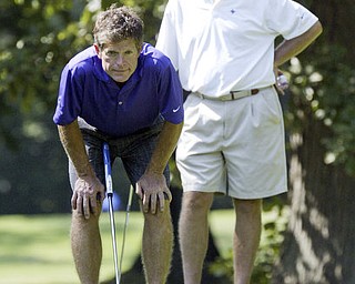 William D Lewis The Vindicator  Joe Malys lines up a putt while Ray Duffett looks on Friday at Mill Creek.
