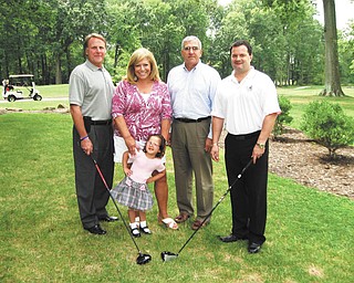 Members of the 4 Square Club and Easter Seals Youngstown Hearing & Speech Center gather at Mill Creek Golf Course. From left to right are Jeff Michalenok, 4 Square Club event chairman; Mary Ann Carano, chairwoman of Easter Seals and YH&SC board; Alfred Pasini, Easter Seals and YH&SC chief operating and development officer; and Thomas Hura, 4 Square Club treasurer, with Lily DeMarco, Easter Seals and YH&SC 2011-12 child representative, in front.