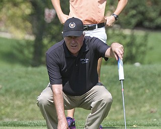 William d Lewis The Vindicator  Jeff Rogner lines up a putt while his daughter Katie Rogner( Last years womens champ) serves as caddy shot Sat at Tippe.