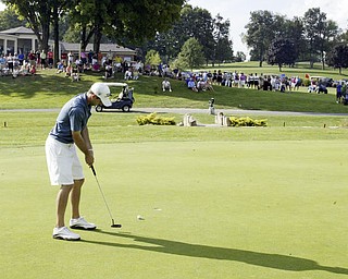 William D. Lewis The Vindicator Anthony Conn winner of open division golf puts on finalgreen at Lake Club Sunday.