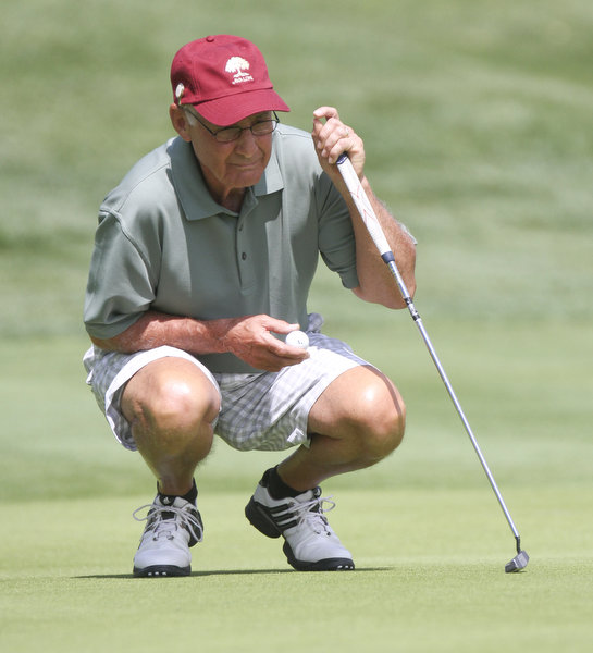 William D. Lewis The Vindicator Ed Antonelli, winner of super senior (CHECK TO MAKE SURE THAT IS RIGHT DIVISION) lines up a putt at Lake Club Sunday.