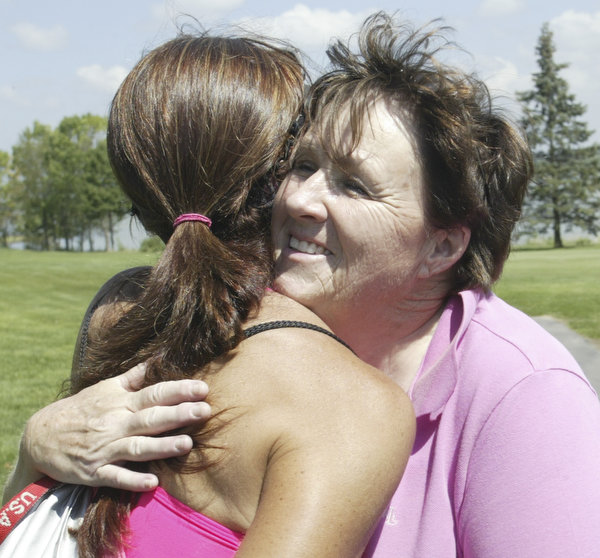 William D. Lewis The Vindicator  Womens winner Lori Bowden , RIGHT, gets a hug fromKathy Garritano after winning at Lake Club Sunday.