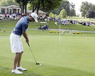 William D. Lewis The Vindicator Anthony Conn winner of open division golf puts on finalgreen at Lake Club Sunday.