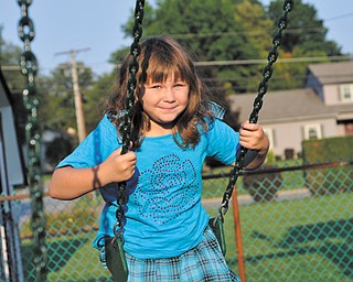 Morganne Evans, 7, has stabilized her weight with a combination of physical activity and healthy food choices. Examples are fruits and vegetables for snacks instead of chips and smaller portions.