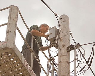 Dave Peters of Enhanced Network Solutions makes the final wireless Internet hookups at the Canfield Fairgrounds’ trailer park. Beginning today, those staying at the trailer park will be able to purchase Internet access for $10 per day or $30 for the entire six days. Timm Schreiber, fair board member, said if all goes well this year they will look into making the entire fairgrounds wireless.