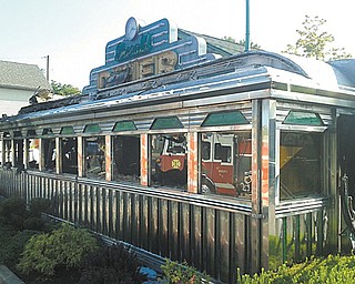The Emerald Diner in Hubbard was severely damaged by a fire Tuesday morning. The train car-turned-restaurant opened in 1994 after owner James P. Marsh brought the 1939 car from Connecticut and transported it to its location on North Main Street. The cause of the fire remains under investigation.