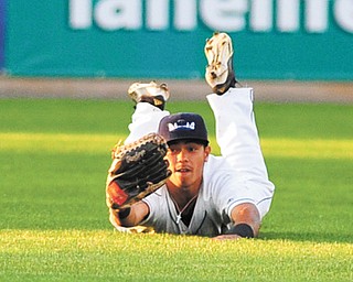 Scrappers center fielder Aaron Siliga holds up his glove to show the umpire he held on to the ball after making a diving catch Tuesday night at Eastwood Field. Batavia swept a doubleheader, 6-2 and 1-0.