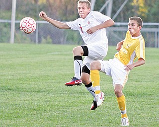 Cardinal Mooney’s Michael Trefethern (12) and Massillon Jackson’s Patrick Zonfa (9) go for the ball Tuesday at Valley Sports. Below: Mooney’s Nicholas Koken (3) and Jackson’s Grant Slovan (19) battle for the ball. Jackson won, 5-0.