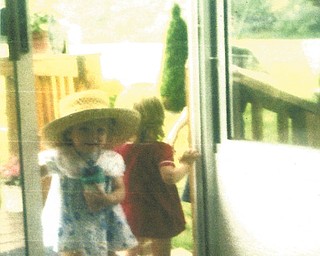 Marilyn Davis of Columbiana sent in this photo of a little girl and a big hat..