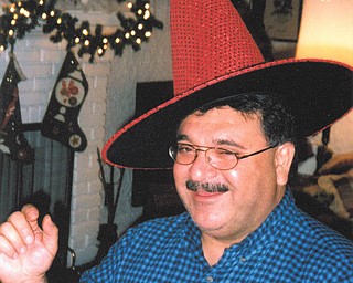 James Gallo gives this sparkly witch hat a try. Photo submitted by Harriet Deeds of Youngstown.