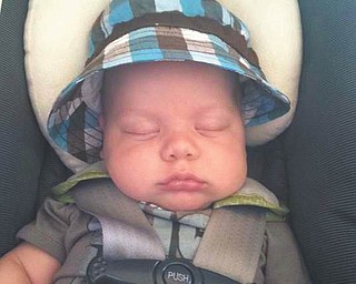 Brady Ford Hodge catches a nap. Photo sent in by grandparents Ron and Cathy Hinderliter of Canfield.