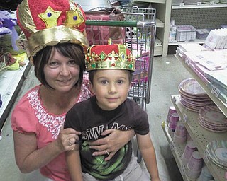 Debbie Horvath and grandson Reilly Horvath have a royal time dressing up with hats.