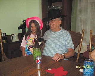 Don Mickey of Struthers, also known as Pappy Don, and his great-granddaughter Mikayla Upright, 7, of Youngstown, show of their taste in hats. Photo sent in by Sheree Upright.