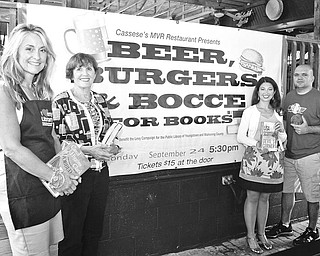 From left, Debbie Liptak, development director for the Public Library; Julie Costas and Natalie Lariccia, committee members; and Joe Cassese, manager of Cassese's MVR; are among those planning the "Beer, Burgers and Bocce" library fundraiser. Photo by MADELYN P. HASTINGS | THE VINDICATOR.