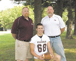 There will be more than a rivalry on the field at tonight’s Boardman-Mooney game. Brothers Doug Velasquez, left, and Tom Velasquez, far right, will face off on opposing sidelines, with Doug serving as defensive assistant for the Spartans, and Tom sharing defensive coordinator duties for the Cardinals. Making things more interesting is that their nephew, Ryan Ebie, center, is a defensive tackle with the Spartans.