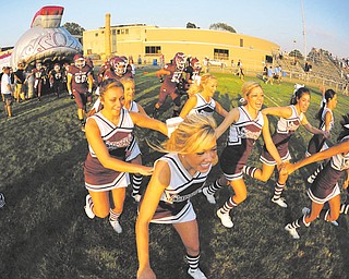 Boardman cheerleaders and players take the field before their game against Cleveland Benedictine