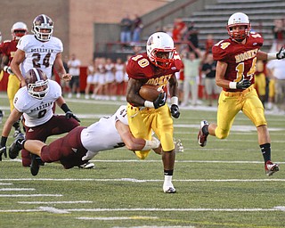 ROBERT K. YOSAY | THE VINDICATOR..Big first down as Mooneys (10) Justus Ellis- Moore gains a first down and 35 yards as Boardmans #47 Brock Hull misses .. looking on is Bdm (8) Ryan Savage and (24) John Babos - Moones (14) Marcus Penza runs along side -.Bdm @ Mooney - Stambaugh Stadium... - -30-..