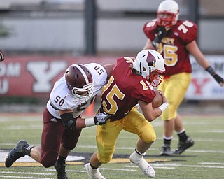 ROBERT K. YOSAY | THE VINDICATOR..Second Quarter action as Mooney (15) QB dDenver Martin pushes on for 4 yards as Boardmans (50) Evan Croutch brings him down. ..Bdm @ Mooney - Stambaugh Stadium... - -30-..