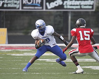 William D Lewis The Vindicator Hubbard's Isaiah Scott (19)) scampers for 1rst half yardage at Girard Friday 8-31-12.Defending is Girard's Anthony Bryant (15).