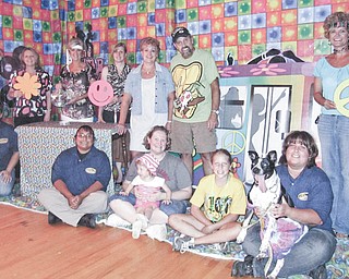 The Humane Society of Columbiana County 2012 Retro R.O.C.C. and Rescue Reverse Raffle is being planned, and some of the staff, sponsors and committee members included from the left in front are Heather Jurina, director; Stephanie Peterson, humane agent; Katie Kaufman with Neve; Lydia Good; adoptable Tille, and Julie Dustman, humane agent. In the back from left are Lisa Shoff, event chair; Lori Everly; Donna Sanor of Sanor Insurance, Dessie and Bob Bates, and Jenny Pike, HSCC president.