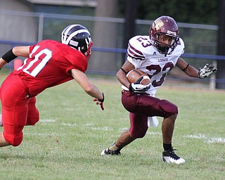 IMG 8838: John Helms (23) of Liberty looks to avoid Chris Parry (10) of Niles Mckinley during the first quarter of Friday nights matchup at Niles Mckinley High School in Niles. ÊDustin Livesay Ê| ÊThe Vindicator 8/31/12 ÊNiles, Ohio