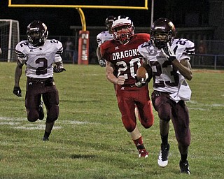 .IMG 8936: Liberty's John Helms (23) returns the opening kick off of the second half for a touchdown while outrunning Josh Mango (20) of NilesÊduring Friday nights matchup at Niles Mckinley High School in Niles. ÊDustin Livesay Ê| ÊThe Vindicator 8/31/12 ÊNiles, Ohio