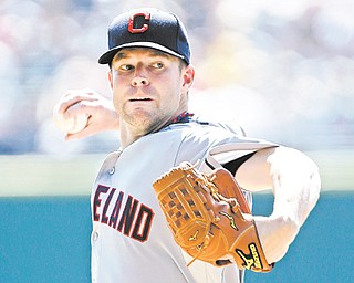 Cleveland Indians starting pitcher Corey Kluber delivers a pitch against the Detroit Tigers in the first inning of a game in Detroit on Monday. Kluber got his first career victory in the Indians’ 3-2 win.