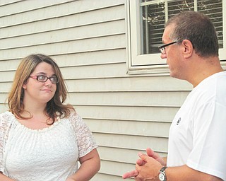 At the annual summer picnic for the Penn State University Alumni Chapter of Greater Youngstown, Emily Lewis, left, was presented with the 2012 Allen Udell Memorial Scholarship of $1,000. She is shown talking with Chapter President Gerry Ricciutti. Lewis was chosen based on grades, academic achievement and college test scores. She will be attending the Shenango campus in Sharon and plans to study nursing. The chapter has awarded more than $18,000 to Penn State freshmen in the past 15 years.