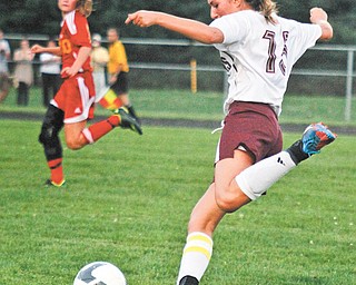 Nicole Deley of Boardman moves the ball upfi eld during Wednesday’s game against Cardinal Mooney. The Cardinals won, 3-2.