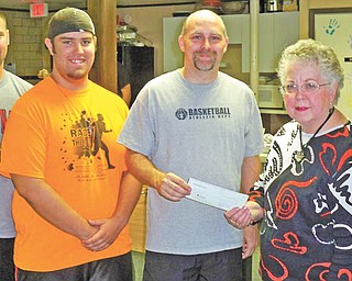 UCT Salem Council 590, a nonprofit financial services membership organization, recently committed to make 12 monthly donations of $50 each to the ROC of Salem Youth Center. From the left are ROC adult volunteer Corey Kuhns, ROC crew member Josh Harbin, ROC Salem Director Eric Hamilton, UCT President Nancy Smith presenting the first check, and her husband, Eugene Smith. UCT meets the second Wednesday of each month at Perkins on Route 62 in Sebring. For information visit www.UCT.org. To learn about ROC, email Hamilton at eric.theroc@hotmail.com.