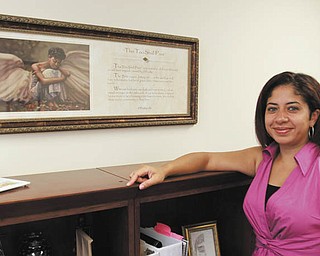 Milly Aponte has come a long way since residing with her baby boy in an apartment at Beatitude House during some tough times. She recently became Beatitude’s newest member on the board directors and will serve on the policy and program-education committees. Photo by: ROBERT K. YOSAY | THE VINDICATOR