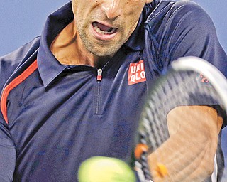 Serbia’s Novak Djokovic returns the ball to Argentina’s Juan Martin del Potro during their quarterfinal match at the U.S. Open on Thursday in Flushing Meadows, N.Y. Djokovic finished off del Potro, 3-0.