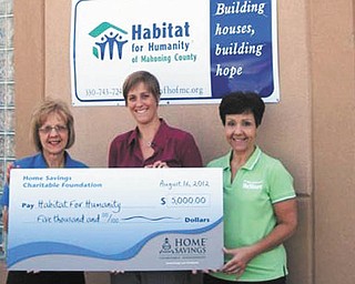 Habitat for Humanity of Mahoning County, a nonprofit, nondenominational Christian ministry, recently received a check for $5,000 from Home Savings Charitable Foundation. The money will be used to help finance the purchase and installation of a new energy-efficient heating/cooling system at Habitat’s ReStore, 480 Youngstown-Poland Road, Struthers. From the left is Mary Kropinak, Home Savings Struthers office; Monica Craven, executive director of Habitat; and Linda Hartwig, ReStore manager. Habitat was founded on the principle that every man, woman and child should have a decent, safe and affordable place to live. For information about Habitat and its services call 330-743-7244 or visit www.habitatmahoningcounty.org.