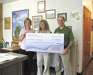 Veterans’ Outreach, a nonprofit charitable organization, was recently presented with a check for $5,000 from Home Savings Charitable Foundation for annual program support. From the left is Mary Kropinak, Home Savings Struthers Office presenting the check to Teri Ely, executive director, and Robert Julian, vice president/treasurer, both of Veterans’ Outreach. The organization has a primary mission of serving and honoring all veterans, including, shelter for homeless vets, rent, utility payments for terminated or near-termination accounts, auto repair, clothing, insurances, relocation, glasses and lay counseling. For information about Veterans’ Outreach call 888-283-8638 or visit www.veteransoutreach.com.