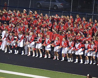 Flag, Rifle and color guard lines having fun cheering on the team