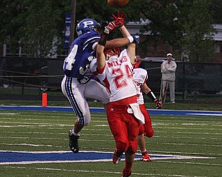 NICK MAYS l THE VINDICATOR  (24) Chris Hillier of Niles and (34) Tad Duran get tangled up the second  quarter of thier game in Poland.  Niles vs Poland 09142012 Poland, Ohio