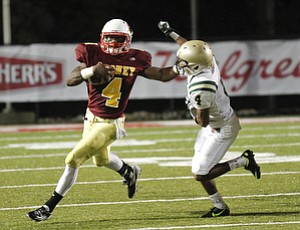 ROBERT K. YOSAY | THE VINDICATOR --..4 on 4 as CM Marcus McWilson stiff arms svsm #4 Fransohn Bickley - during third quarter action - Akron St Vincent St Mary @ Cardinal Mooney at YSU Stadium..(AP Photo/The Vindicator, Robert K. Yosay)