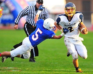 Mcdonald quarterback #2 Christian Rusinowski runs through a arm tackle of defensive back Danny Rosati #5 of Western Reserve on a 4th down an 1. McDonald was successful on the conversion.