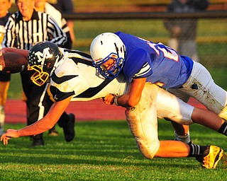 Mcdonalds #10 Cameron Ifft reaches for the goal line to score a touchdown while Western Reserve defensive back #22 Jon Timko tried to make the takle.