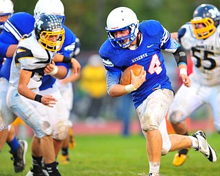 Western Reserve running back #44 Dan Zilke runs the ball for a first down.