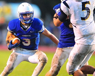 Western Reserve running back #3 Tim Cooper runs the ball down by the goal line during the second quarter.