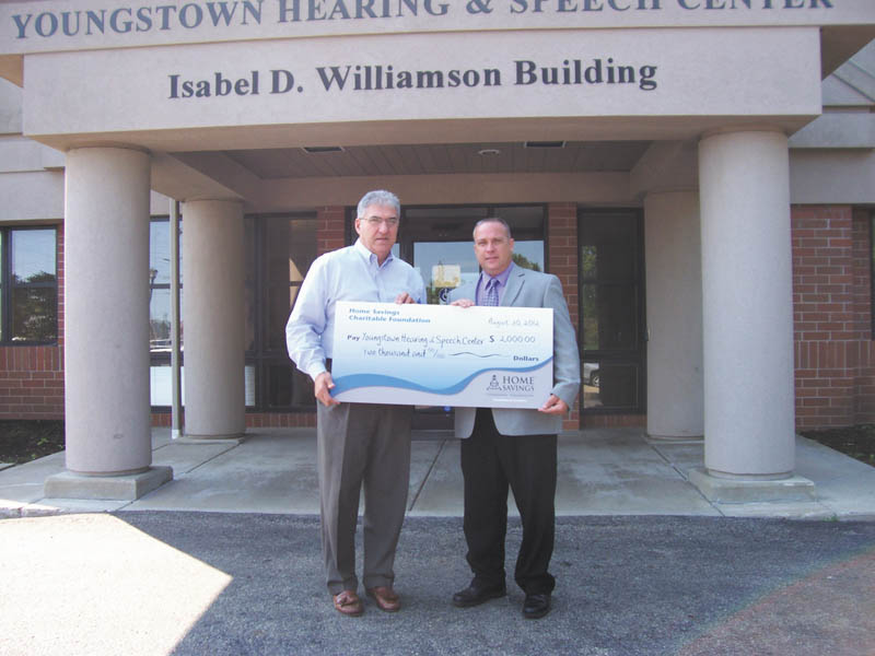 Home Savings Charitable Foundation recently presented Youngstown Hearing & Speech Center, a local nonprofit organization, with a check for $2,000. YHSC Executive Director Alfred Pasini, left, received the check from Frank Constantino of the Home Savings Boardman office. The funds will be used to help people with disabilities or special needs live with dignity and independence. For more information about YHSC and its services, call 330-726-8855 or visit www.yohsc.com.