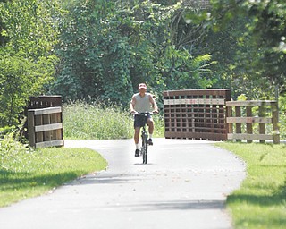David Szakacs of Lordstown tries out the new Niles Greenway Bike Path addition now open for biking and
walking. The trail is part of the 100-mile Great Ohio Lake to River Greenway.