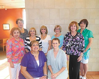 Volunteers supporting Yellow Brick Place include Donna Detwiler, seated at left, co-founder and cancer survivor, and Anna Aey. Other committee members for the fashion show fundraiser standing from left are Angie Palumbo, Mary Ann Zalka, Harriet Cohen, Jean Wainio, Carole Weimer, Denise Keenan and Shellie Warino.